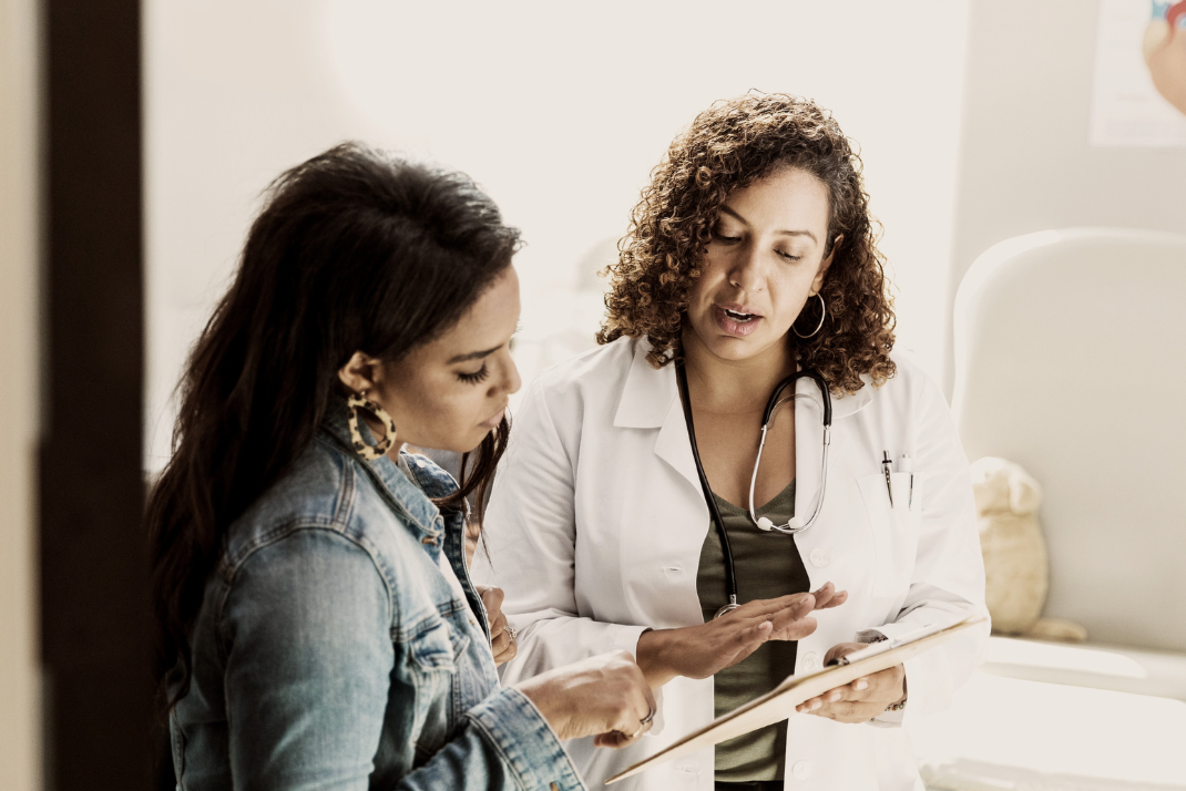 Doctor discussing Genea fertility service options with patient
